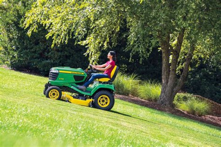 Can I use a riding mower on a hill