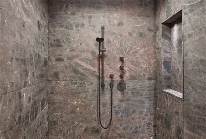 Can you put granite on shower walls