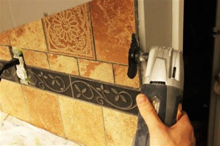 Do you have to remove cabinets to install tile
