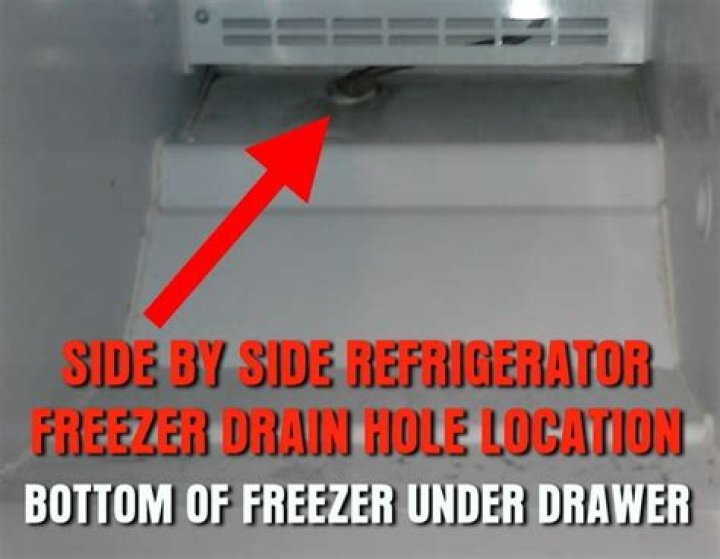 How do you clean a frozen freezer drain hole and tube