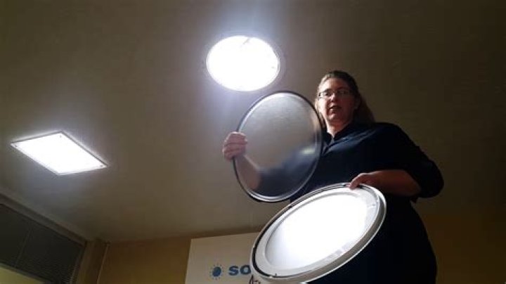 How do you clean a Solatube lens