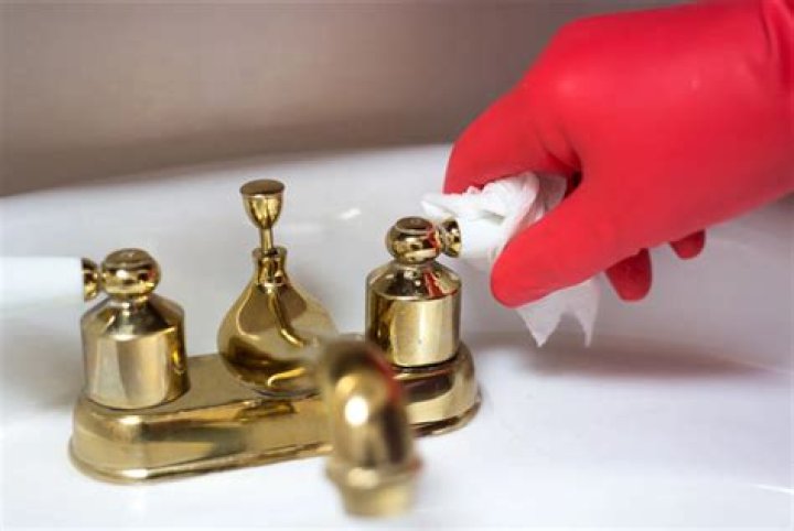 How do you clean unlacquered brass faucets
