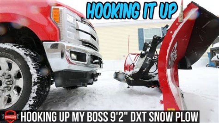 How does a snow plow attach to a truck