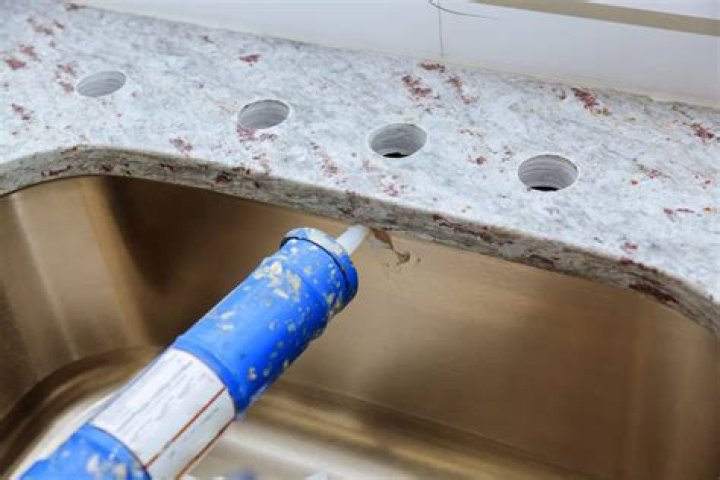 What adhesive is used for granite countertops