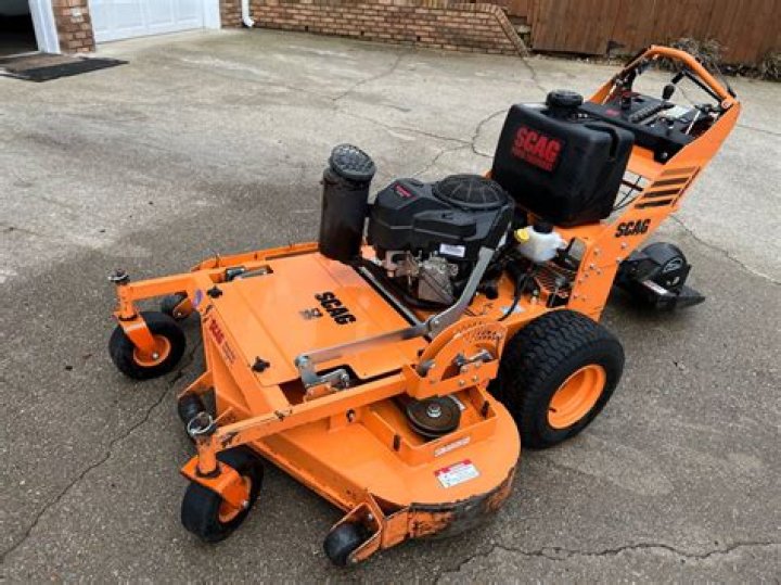 What does walk behind mower mean