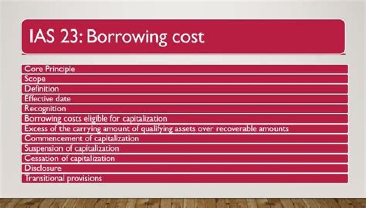 What is the benchmark treatment of borrowing cost under IAS 23