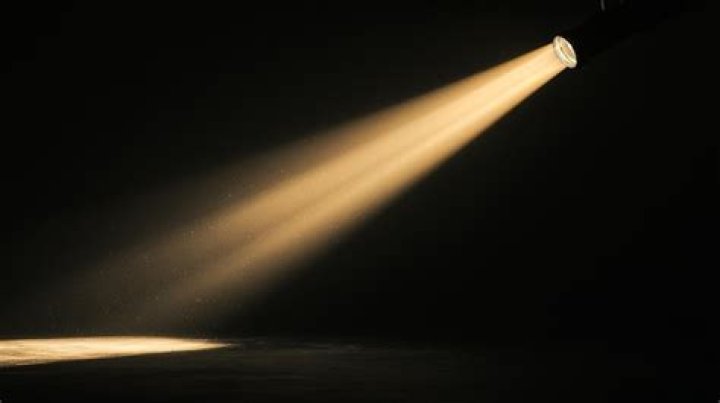 Which lighting instrument delivers a sharply focused beam of light