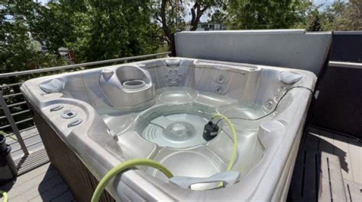 Why does my hot tub drain into my pool
